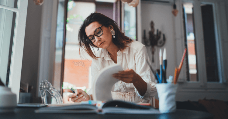 Small business owners reviewing notes at her desk